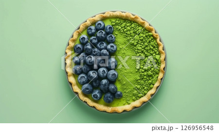 Top of view pie cake topping blueberry and matcha gluten free homemade on solid background 126956548