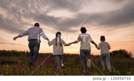 run mother father children boy girl park sunset, man woman toddlers outdoors, Family walking in the field at sunset, Parents and children holding hands outdoors, Happy family time in nature, Summer run mother father children boy girl park sunset, man woman toddlers outdoors, Family walking in the field at sunset, Parents and children holding hands outdoors, Happy family time in nature, Summer 126956738