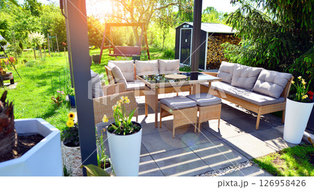 Modern aluminum pergola with stylish garden furniture in a beautiful garden. Modern aluminum pergola with stylish garden furniture in a beautiful garden. 126958426
