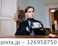 young elegant dandy man drinking morning coffee in his mansion 126958750