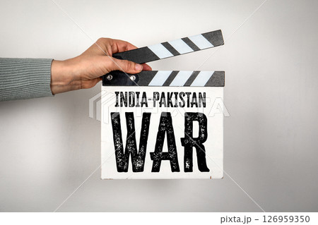 India-Pakistan War Concept on Film Clapperboard Held by Hand 126959350