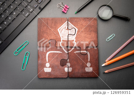 Pope, leadership concept. Wooden puzzle pieces with text on a dark office table Pope, leadership concept. Wooden puzzle pieces with text on a dark office table 126959351