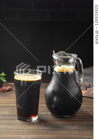 Glass and jug of russian bread drink kvass Glass and jug of russian bread drink kvass 126959920