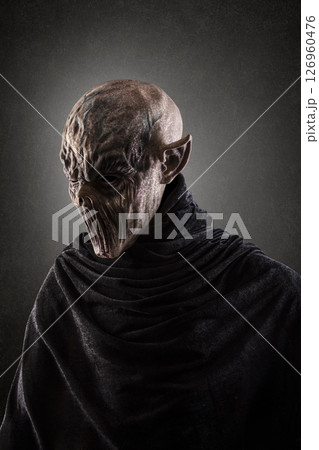 Portrait of a creepy monster over dark misty background 126960476