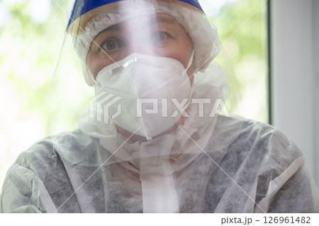 Doctor in a protective mask and suit for coronavirus infection. Doctor in a protective mask and suit for coronavirus infection. 126961482