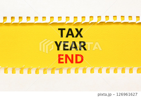 Tax year end symbol. Concept words Tax year end on beautiful yellow paper. Beautiful yellow white background. Business tax year end concept. Copy space. 126961627