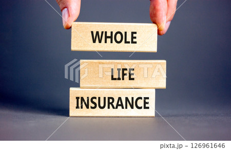 Whole life insurance symbol. Concept words Whole life insurance on beautiful wooden blocks. Beautiful grey background. Businessman hand. Business whole life insurance concept. Copy space. Whole life insurance symbol. Concept words Whole life insurance on beautiful wooden blocks. Beautiful grey background. Businessman hand. Business whole life insurance concept. Copy space. 126961646