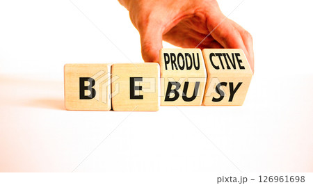 Be productive not busy symbol. Concept words Be productive Be busy on wooden block. Beautiful white table white background. Businessman hand. Business be productive not busy concept. Copy space. 126961698