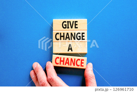 Give change a chance symbol. Concept words phrase Give change a chance on beautiful wooden blocks. Beautiful blue paper background. Businessman's hand Business Give change a chance concept Copy space Give change a chance symbol. Concept words phrase Give change a chance on beautiful wooden blocks. Beautiful blue paper background. Businessman's hand Business Give change a chance concept Copy space 126961710