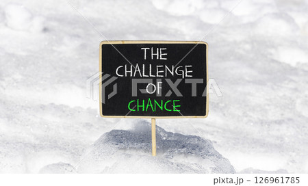 The challenge of chance symbol. Concept words phrase The challenge of chance on beautiful black blackboard. Beautiful white snow background. Business The challenge of chance concept. Copy space. 126961785