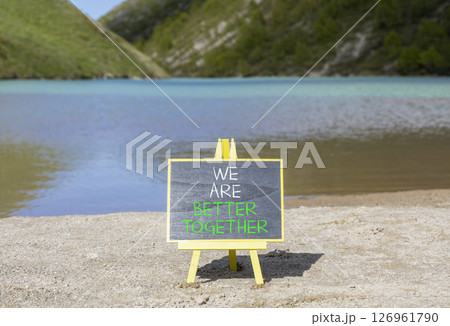 We are better together symbol. Concept words phrase We are better together on beautiful black blackboard. Beautiful mountain lake background. Business We are better together concept. Copy space. We are better together symbol. Concept words phrase We are better together on beautiful black blackboard. Beautiful mountain lake background. Business We are better together concept. Copy space. 126961790