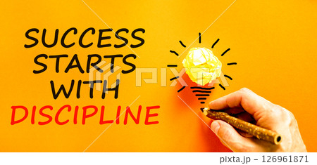 Success starts with discipline symbol. Concept words Success starts with discipline on beautiful orange paper. Beautiful orange background. Business success starts with discipline concept. Copy space Success starts with discipline symbol. Concept words Success starts with discipline on beautiful orange paper. Beautiful orange background. Business success starts with discipline concept. Copy space 126961871