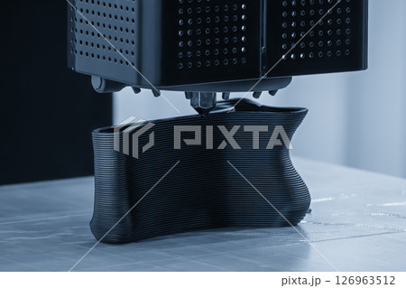 Close up scene the additive manufacturing by 3D printer machine in the light blue scene. Close up scene the additive manufacturing by 3D printer machine in the light blue scene. 126963512