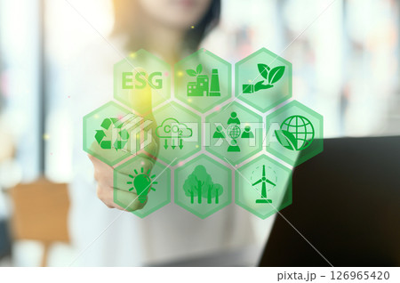 Focused women analyze corporate ESG strategy for sustainable development goals. Business organization uses ESG digital icons for environment social governance investment insights and future growth Focused women analyze corporate ESG strategy for sustainable development goals. Business organization uses ESG digital icons for environment social governance investment insights and future growth 126965420