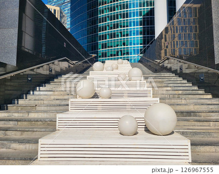 Moscow, Russia 09 10 2024 On the white staircase, modern white balloons in the developing business district of Moscow 126967555