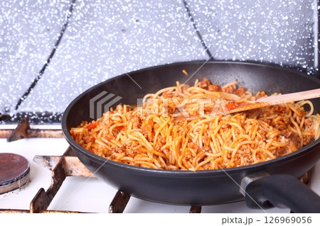 Boiling Spaghetti Pasta in a skillet 126969056