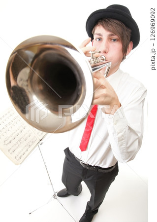Portrait of a young man playing his Trumpet Portrait of a young man playing his Trumpet 126969092