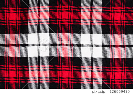 background in a cage white with red and black fabric close-up 126969459