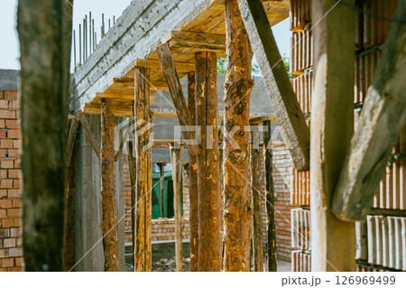 construction residential new house in progress at building site. High quality photo construction residential new house in progress at building site. High quality photo 126969499