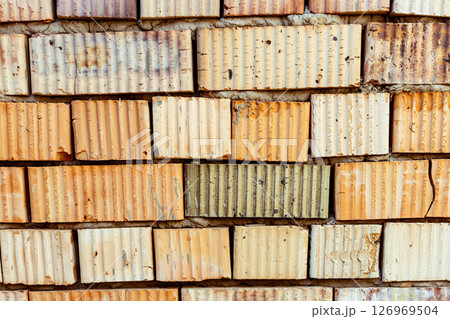 Close Up Of Bricklayer's Hand Placing Brick On Wall. High quality photo 126969504