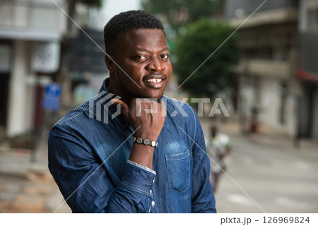 smiling man lost in positive thinking. smiling man lost in positive thinking. 126969824