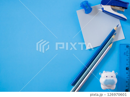 Superior view of didactic elements arranged on a plain light blue background .Copy sapce. Superior view of didactic elements arranged on a plain light blue background .Copy sapce. 126970601