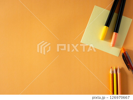 Stylish School Supplies Flat Lay for New School Year.Minimalist orange background. Stylish School Supplies Flat Lay for New School Year.Minimalist orange background. 126970667