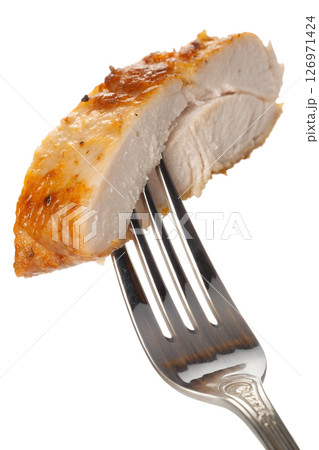 Close-up of roasted chicken breast on a fork, isolated on transparent background, healthy protein meal, perfect for fitness content, diet plans, or food packaging 126971424
