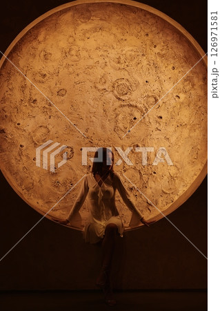 A Stunning Perspective of a Beautiful Moonlit Scene Featuring an Enigmatic Figure A Stunning Perspective of a Beautiful Moonlit Scene Featuring an Enigmatic Figure 126971581