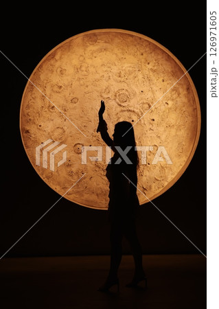 A stunning silhouette against a lunarinspired design a captivating, charming night scene 126971605