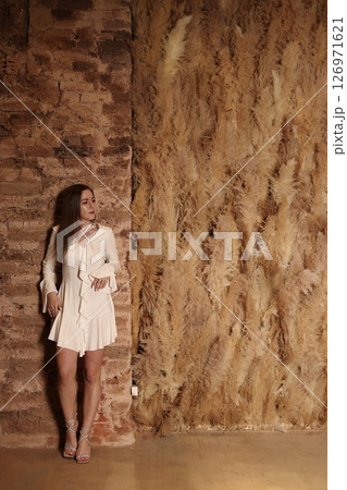 A Poetic Body Pose Embodying Serenity in White, Captured Against Beautiful Natural Textures A Poetic Body Pose Embodying Serenity in White, Captured Against Beautiful Natural Textures 126971621