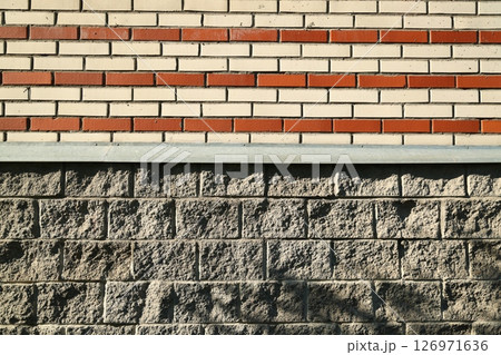 Textured Wall Featuring Both Brick and Stone Patterns for a Unique Architectural Aesthetic 126971636