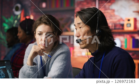 Call center team leader supervising agent...の写真素材 [126972163] - PIXTA