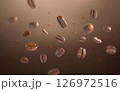 Roasted coffee beans levitate with dark background. Coffee beans flying and falling use for background. Close up image. 126972516