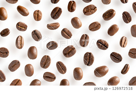 Roasted coffee beans. Scattered coffee beans on a white background with clipping paths. Close up. 126972518