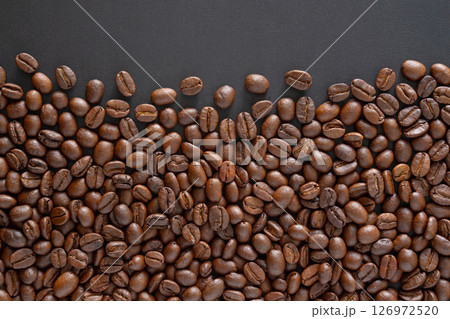 Coffee beans background. Top view coffee beans with copy space area for your text. Close up image. Coffee beans background. Top view coffee beans with copy space area for your text. Close up image. 126972520