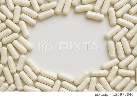 White capsules pile top view with clean space 126973846