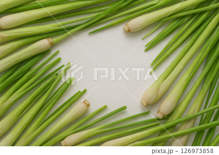 Fresh lemongrass pile with water drops top view Fresh lemongrass pile with water drops top view 126973858