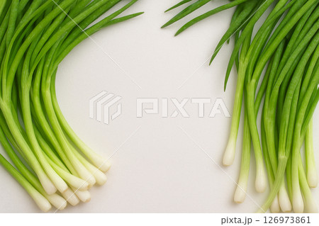 Fresh green onions pile with water drops top view 126973861