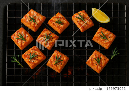 Grilled salmon steak on charcoal with rosemary Grilled salmon steak on charcoal with rosemary 126973921
