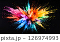 Colorful powder paints explode in a vibrant burst against a black background. 126974993
