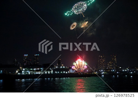 Fireworks display over Yokohama Port during a lively festival celebration at night 126978525