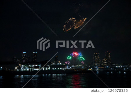 Fireworks display over Yokohama Port during a lively festival celebration at night Fireworks display over Yokohama Port during a lively festival celebration at night 126978526