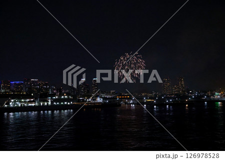 Fireworks display over Yokohama Port during a lively festival celebration at night Fireworks display over Yokohama Port during a lively festival celebration at night 126978528