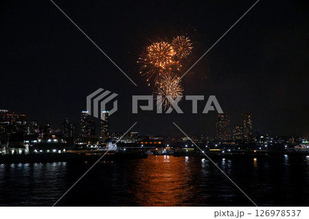 Fireworks display over Yokohama Port during a lively festival celebration at night Fireworks display over Yokohama Port during a lively festival celebration at night 126978537