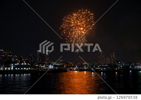 Fireworks display over Yokohama Port during a lively festival celebration at night 126978538