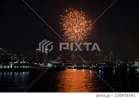 Fireworks display over Yokohama Port during a lively festival celebration at night Fireworks display over Yokohama Port during a lively festival celebration at night 126978541