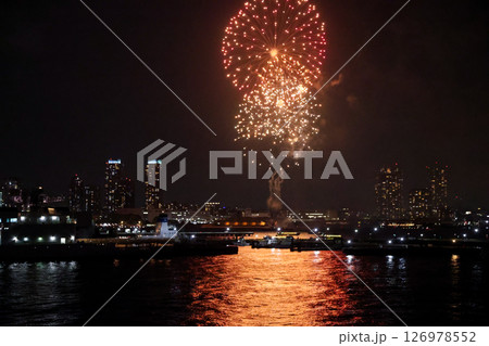 Fireworks display over Yokohama Port during a lively festival celebration at night 126978552