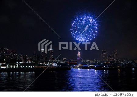 Fireworks display over Yokohama Port during a lively festival celebration at night 126978558