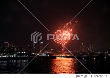 Fireworks display over Yokohama Port during a lively festival celebration at night Fireworks display over Yokohama Port during a lively festival celebration at night 126978563